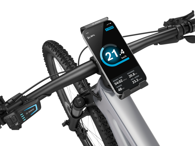 Close-up of eBike handlebars with a SmartphoneGrip Vertical holding a smartphone placed in the center.