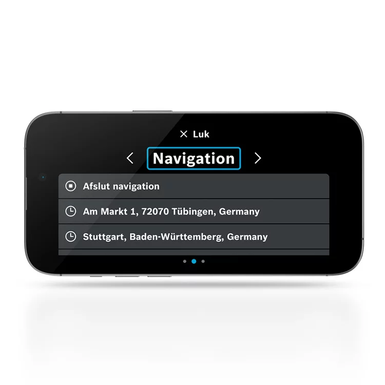 På en liggende, fritstående smartphone kan man se en skærm, der viser feltet "Navigation". Derudover er indstillingen "Afslut navigation" og destinationsadresserne synlige.