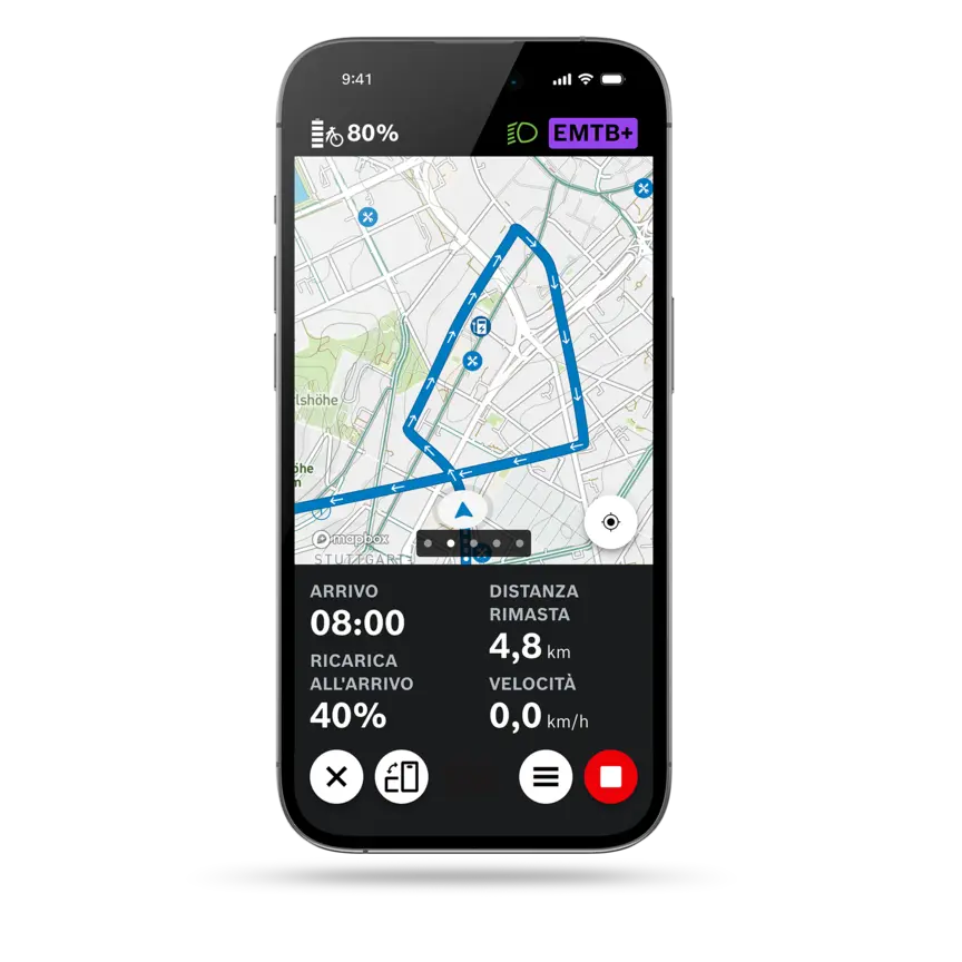 Screenshot del display di uno smartphone che mostra la navigazione attiva del percorso nell'app eBike Flow, con mappa, orario di arrivo, distanza rimanente, stato di carica all'arrivo e velocità attuale.