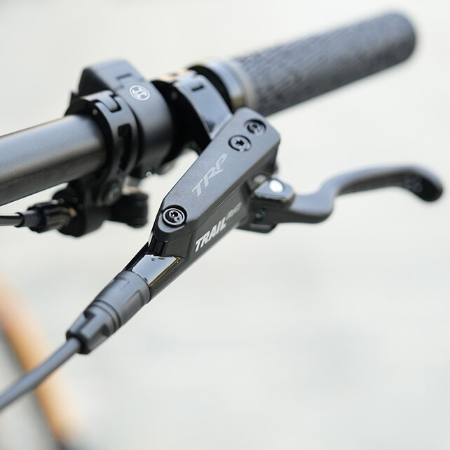 A close-up of a TRAIL brake on an eBike.