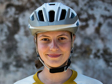 Greta Weithaler from the chest up wearing a bike helmet
