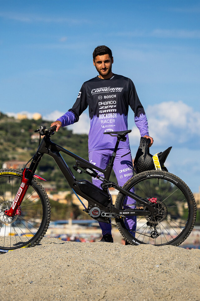 Kevin Marry from the Lapierre Overvolt Racing team poses with his eBike.