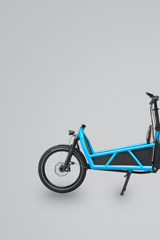 An isolated blue Cargo eBike against a light gray background.