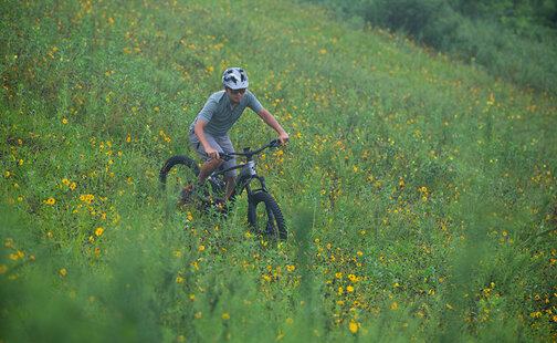 Riders ride downhill