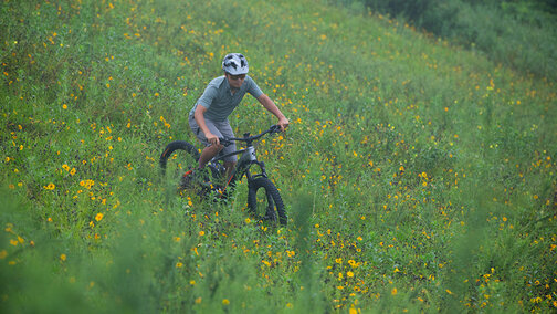 Riders ride downhill