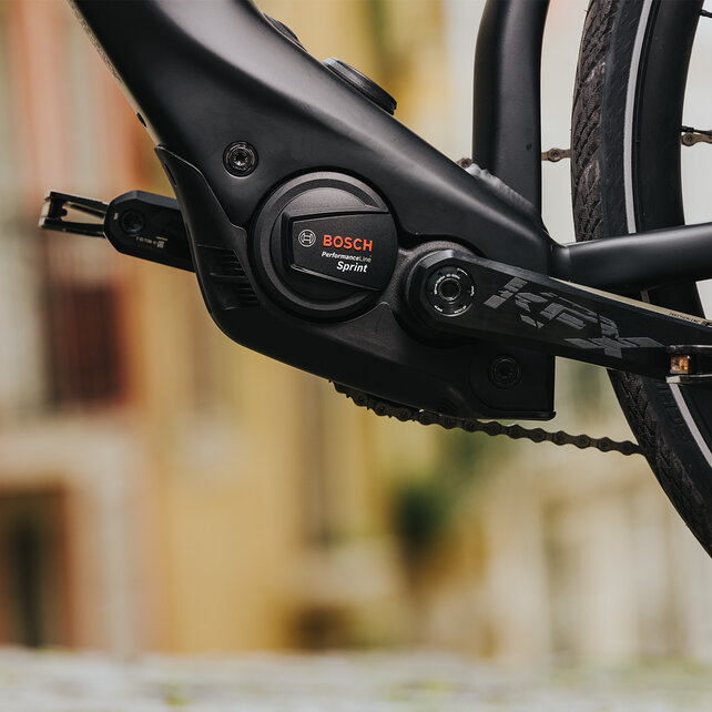 A close-up of an eBike with a focus on the motor. The eBike features a Bosch Performance Line Sprint motor.