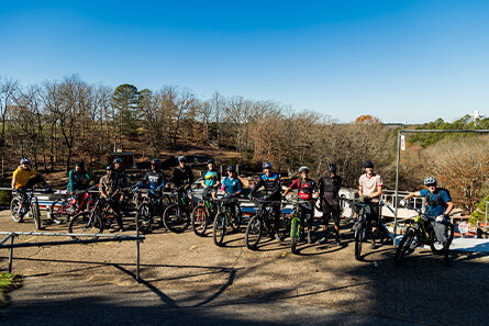 The group of pro-athletes with their bikes in Bentonville.
