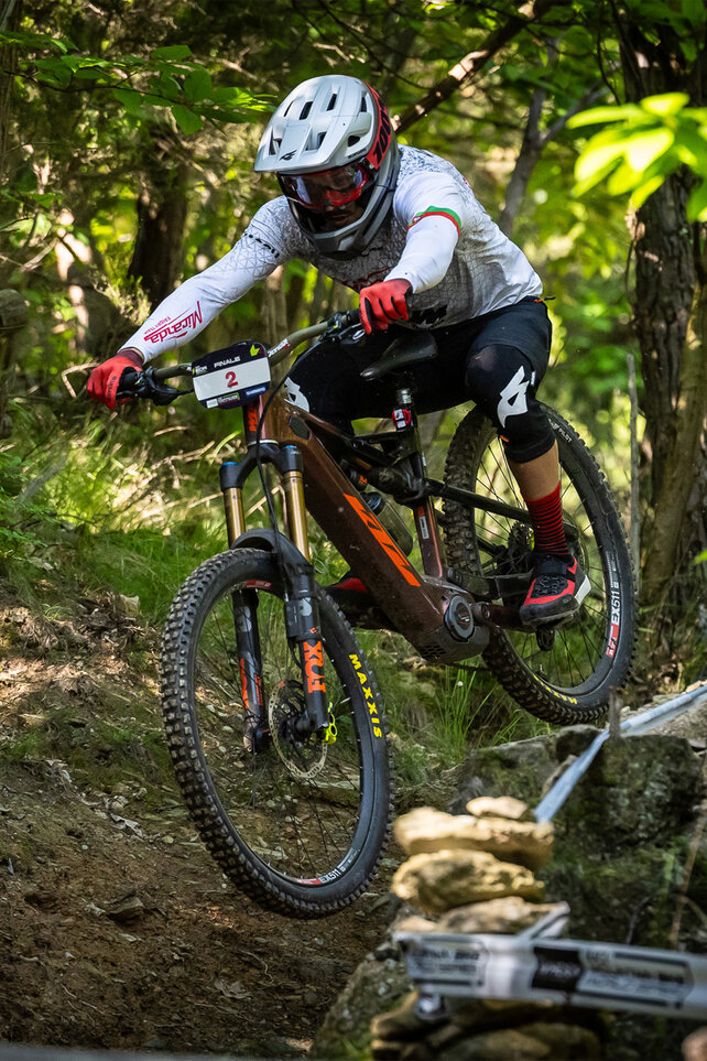 A team member of the Miranda Factory Racing team is riding through challenging terrain with his eMountain bike.