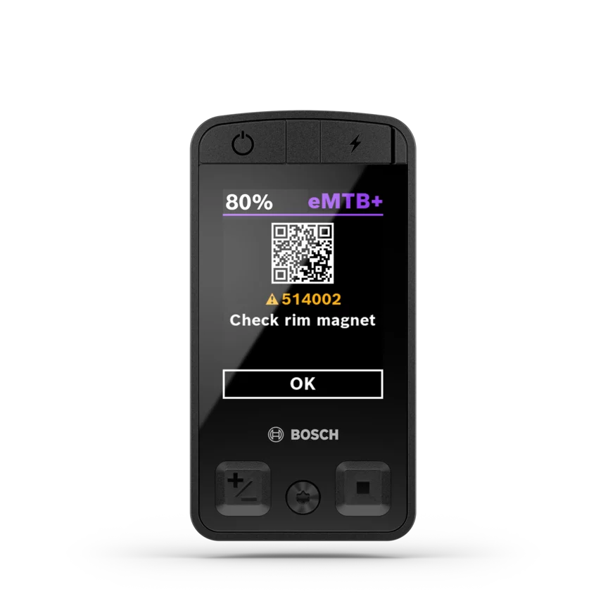 Screenshot van een eBike display met een foutmelding A514002 "Check velgmagneet" en een QR-code voor meer informatie.