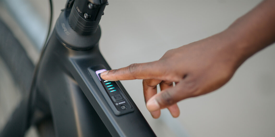 A person turns on the eBike.