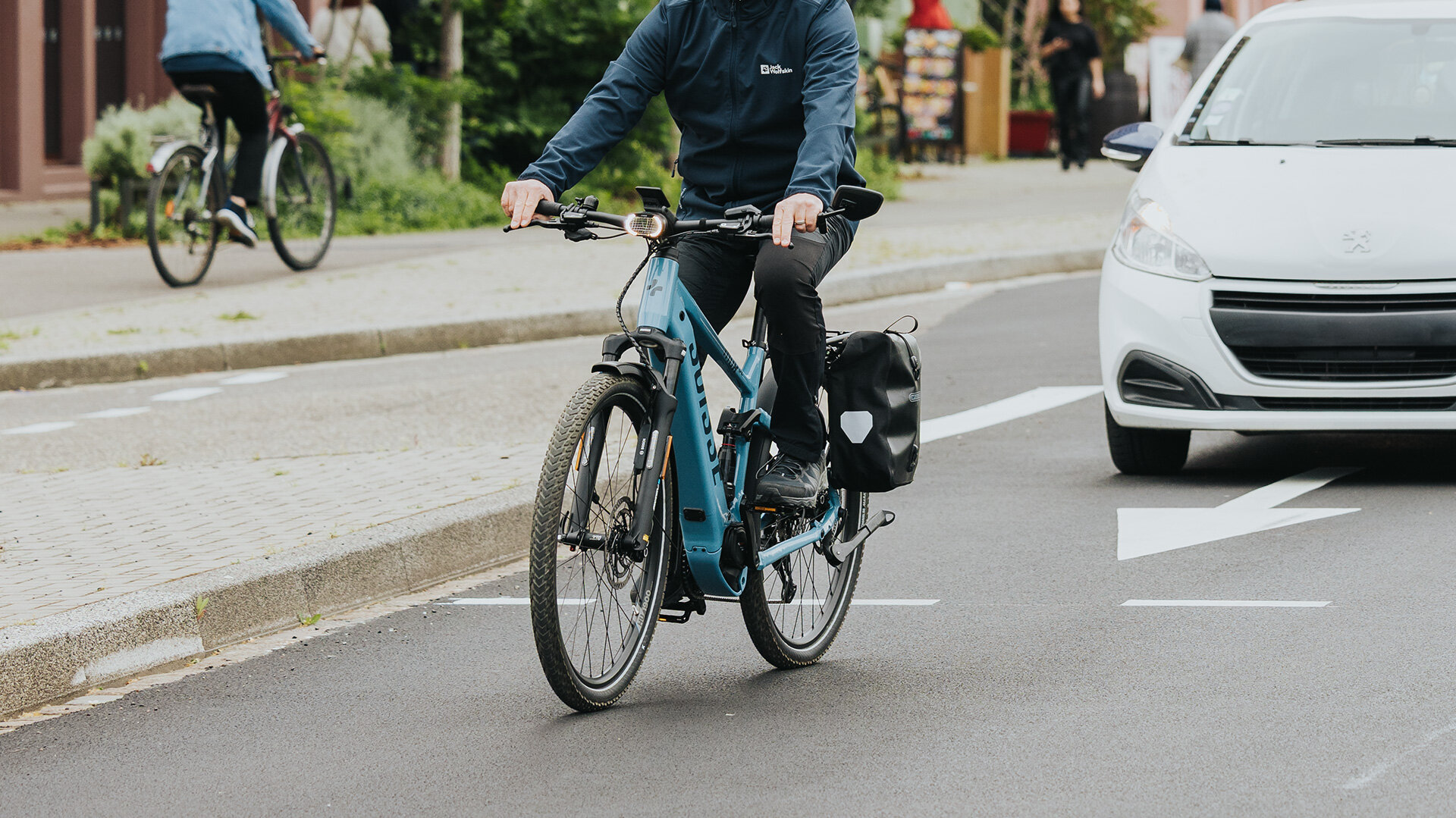 A man stops at a busy intersection.