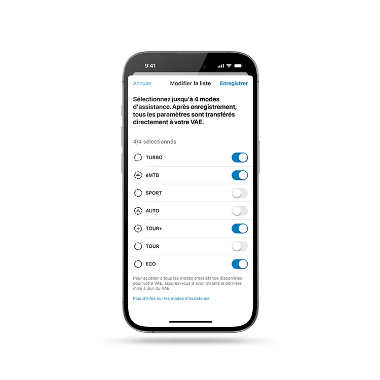Smartphone présenté avec l’application eBike Flow ouverte, affichant la sélection du mode.