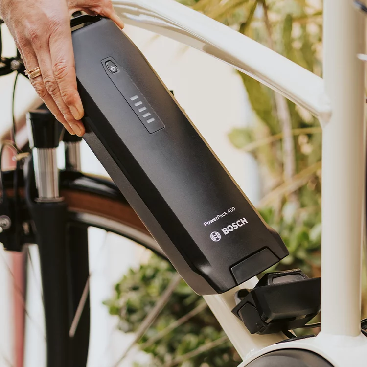 Close-up of a PowerPack 400 attached to a white eBike.
