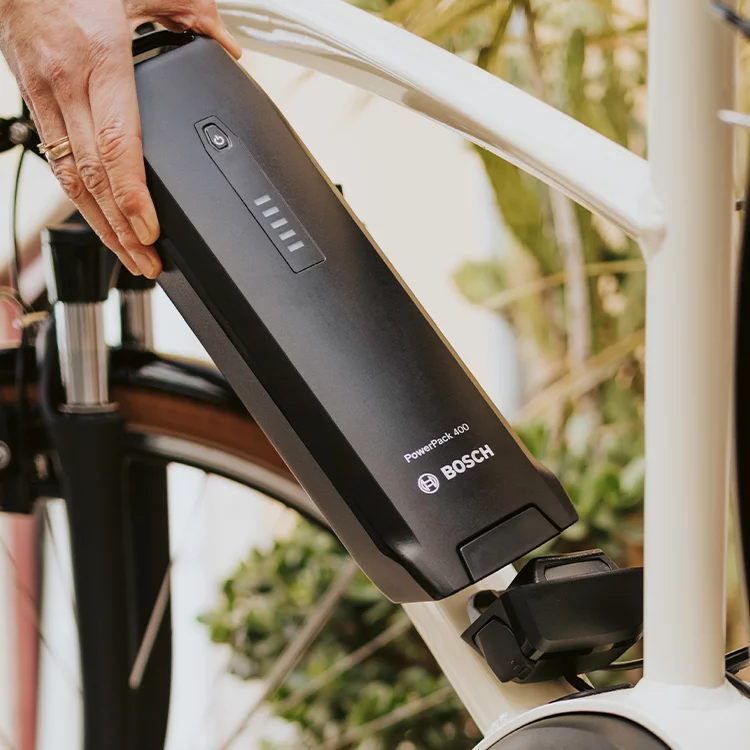 Close-up of a PowerPack 400 attached to a white eBike.