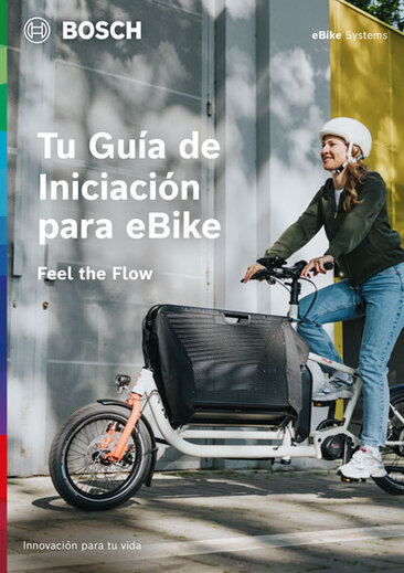 Portada de un folleto de producto con el texto "Your eBike Starter Guide", debajo de "Feel the Flow". La imagen de fondo muestra a un eBiker. En la esquina superior derecha aparece "eBike Systems".