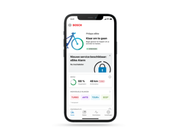 Screenshot van het startscherm van de eBike Flow-app, waar de nieuwe eBike Alarm Service te zien is, die een extra beveiligingsfunctie biedt voor eBike-gebruikers.