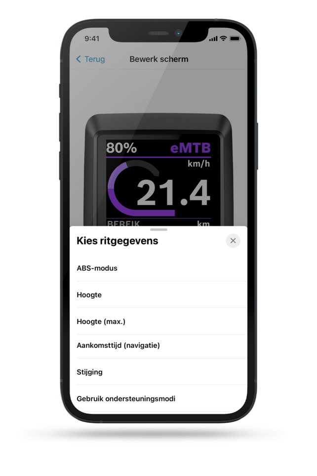 Screenshot van een smartphone scherm toont een Kiox-display op de achtergrond, met op de voorgrond een menu met de tekst 'Kies rijgegevens'. Hieronder zijn opties te vinden: ABS-modus, accu (eBike), accu (smartphone), aankomsttijd (navigatie), stijging, remtijd.