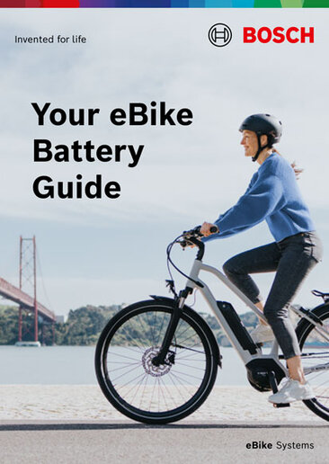 Cover of a product brochure with the text "Your eBike battery guide". The background image shows an eBike rider. At the bottom right is eBike Systems.