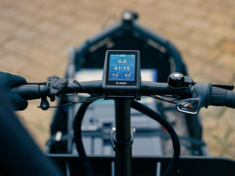 Close-up of the handlebars and load basket on a Cargo eBike.