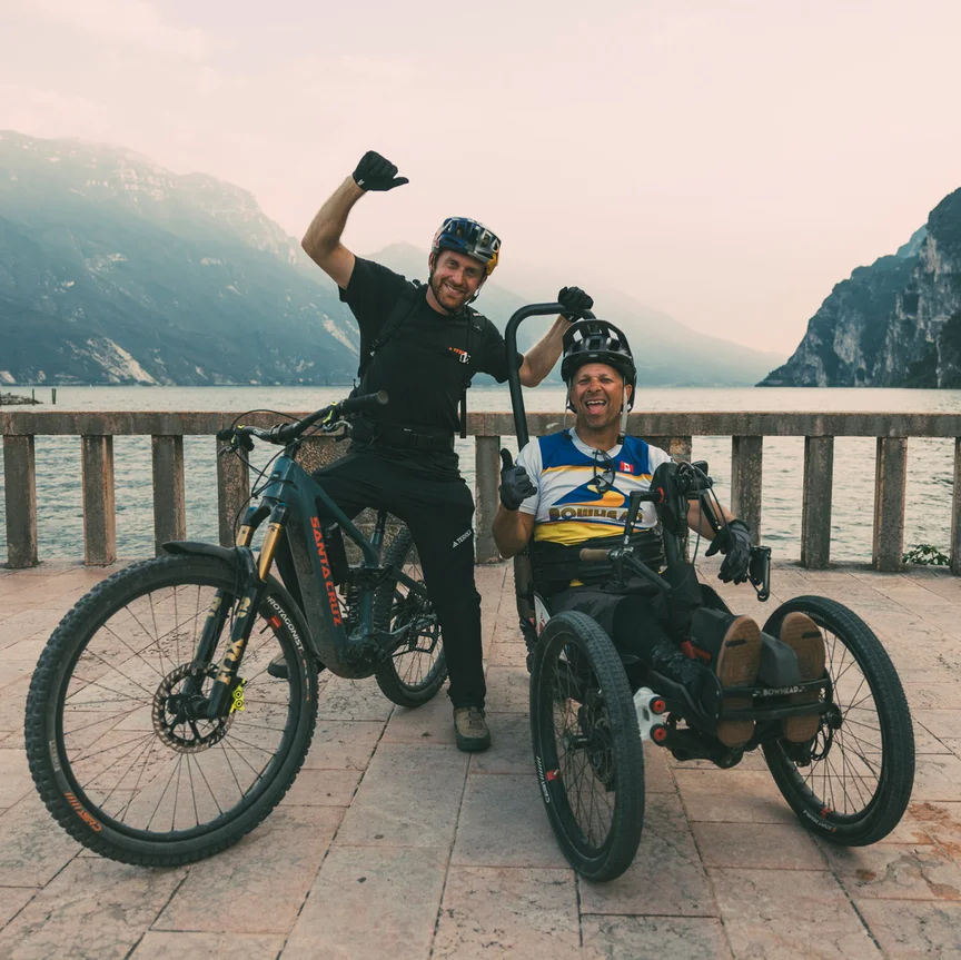 Danny MacAskill and Tarek Rasouli have made it to their destination — Lake Garda —exhausted but happy, with Danny on his eMTB and Tarek on his handbike.