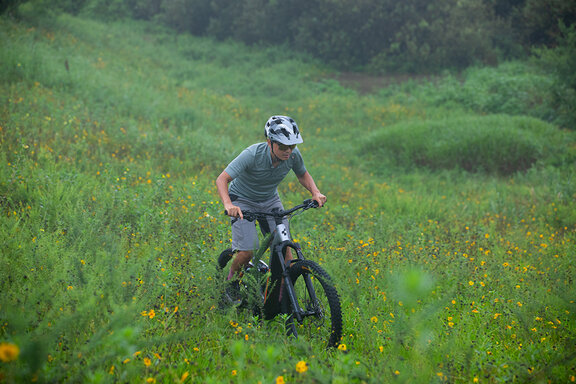 Riders ride downhill 2