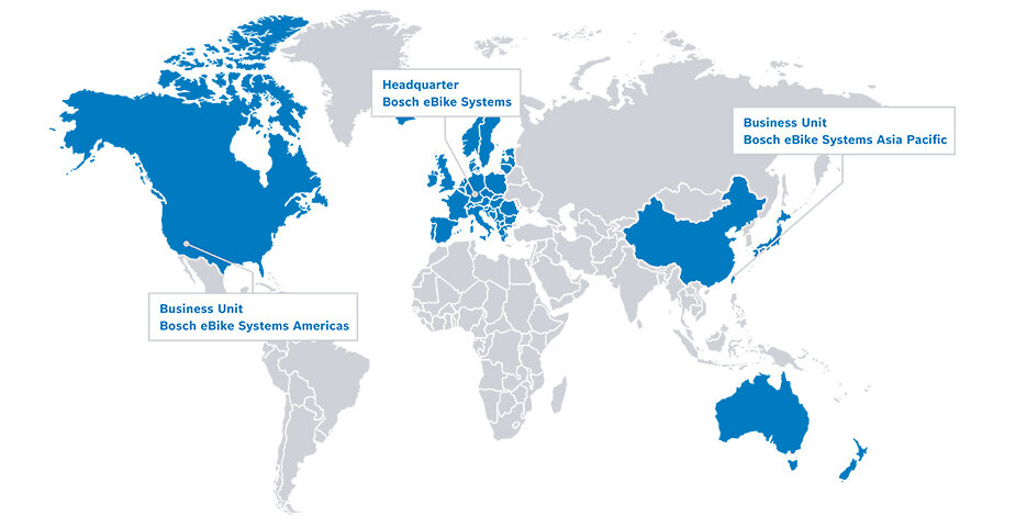World map in white and grey, with blue-marked regions for North America, Europe, China, Taiwan, Japan, and Australia. A speech bubble from the USA displays the text 'Business Unit Bosch eBike Systems Americas', from Europe 'Headquarters Bosch eBike Systems', and from Taiwan 'Business Unit Bosch eBike Systems Asia Pacific'.