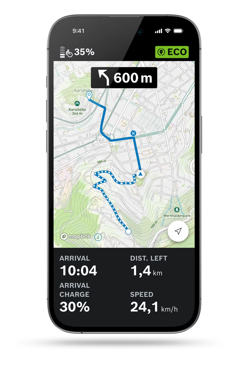 Cropped display of the eBike Flow app on a light grey background with the route open showing which a navigation route is currently displayed together with the arrival time, remaining distance, speed and battery charge.