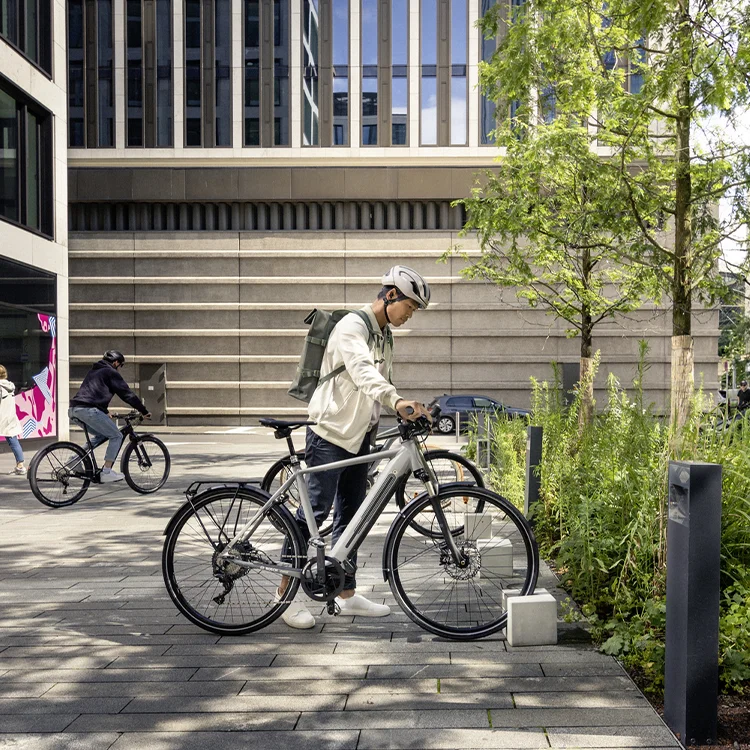 The eBike rider parks his eBike in the designated area in front of a store.