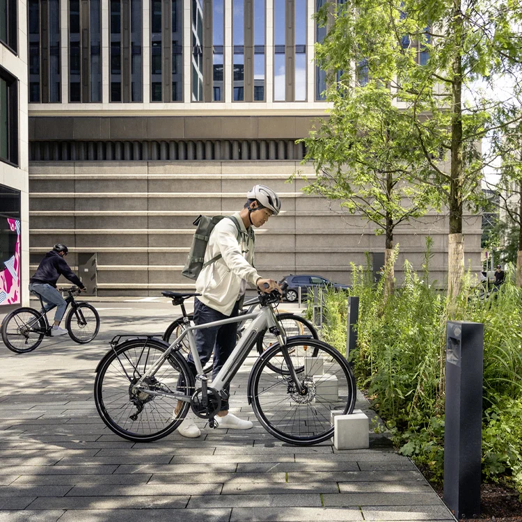 The eBike rider parks his eBike in the designated area in front of a store.