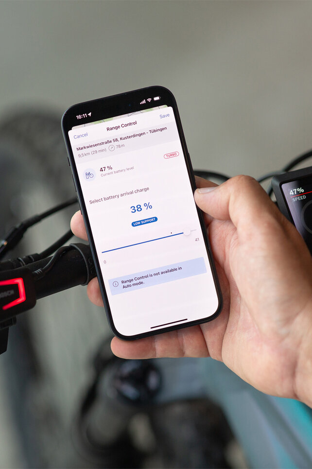 View of a smartphone showing the battery level being set for when the goal is reached via the eBike Flow app.