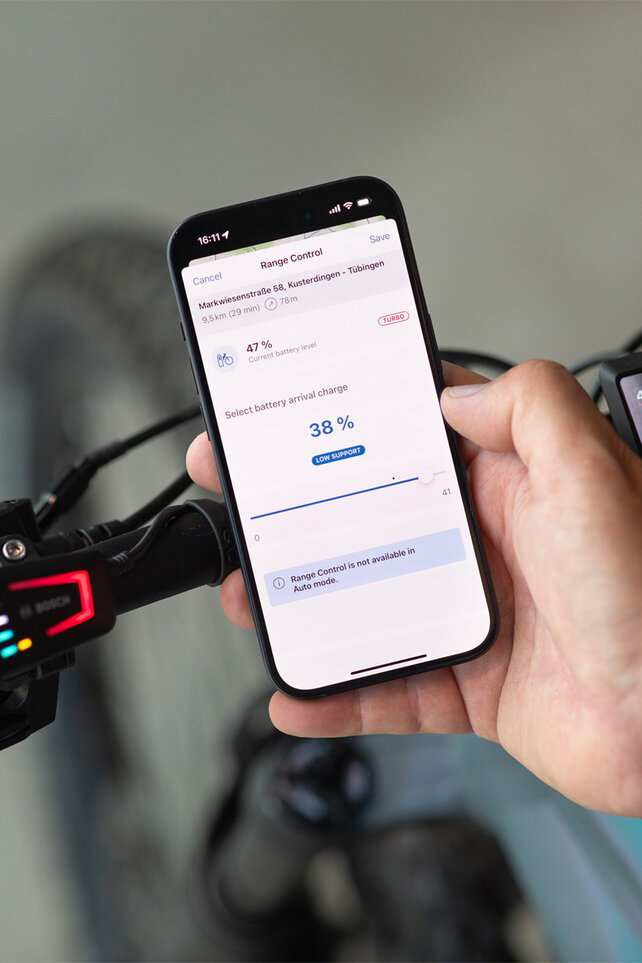 View of a smartphone showing the battery level being set for when the goal is reached via the eBike Flow app.