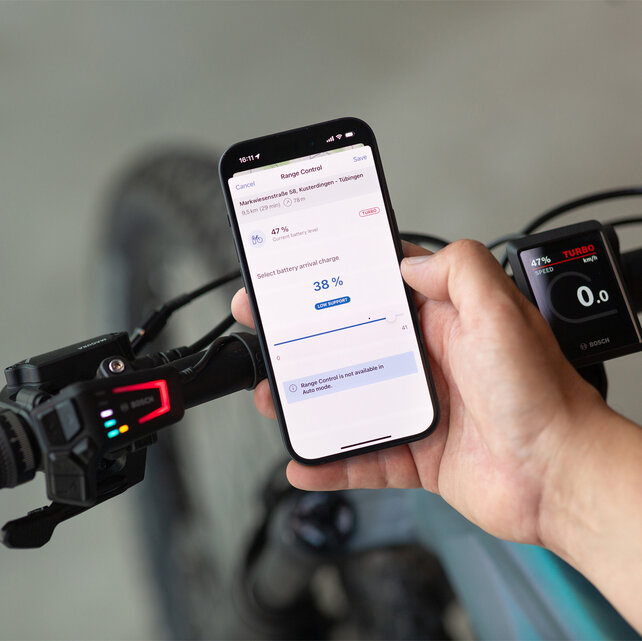 View of a smartphone showing the battery level being set for when the goal is reached via the eBike Flow app.