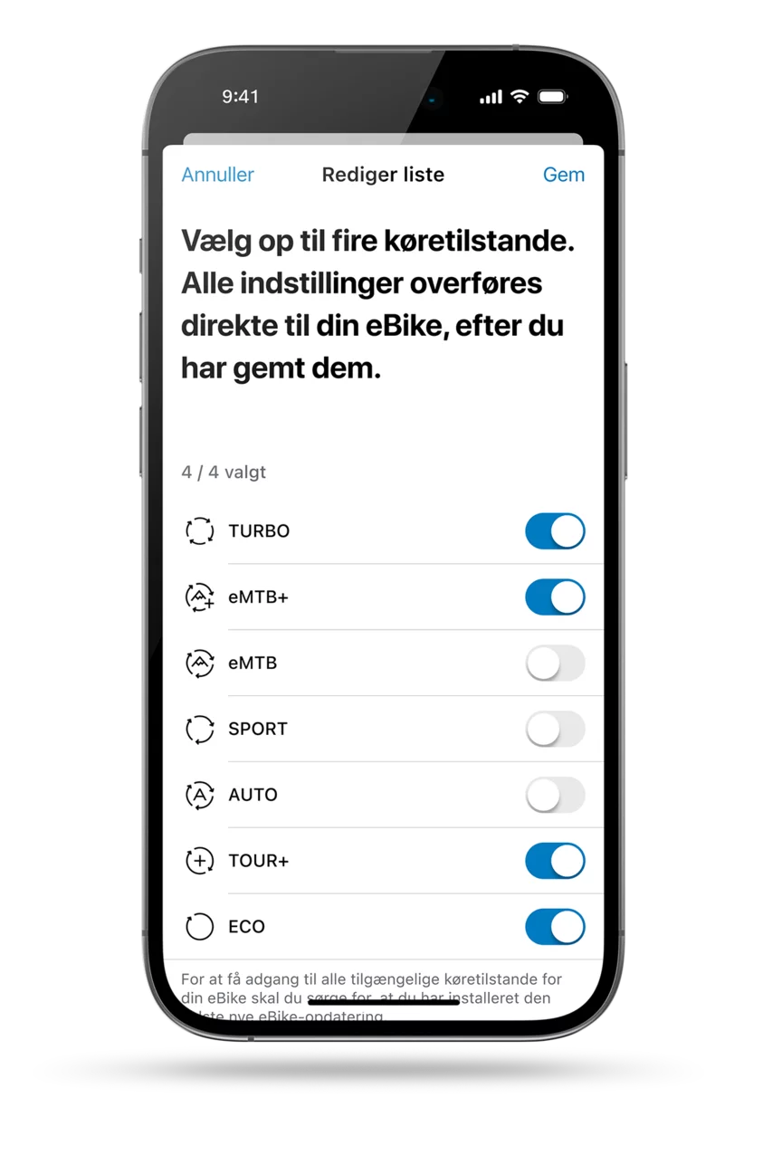 Skærm af eBike Flow-app: Liste over tilgængelige køretilstande (Turbo, eMTB+, eMTB, Sport, Auto, Tour+, Eco) til individuel tilpasning af eBike. Du kan maksimalt vælge fire køretilstande. Valgt er "Turbo, eMTB+, Tour+ og Eco".