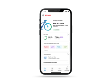 Smartfon umożliwiający korzystanie z aplikacji eBike Flow otwartej na ekranie głównym.