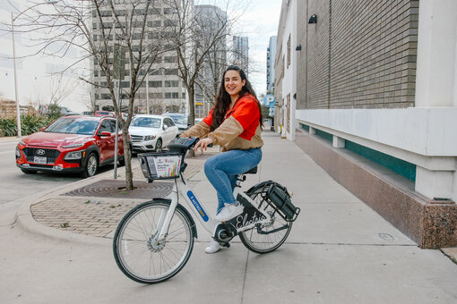 Woman-on-BCycle-eBike-with-Austin-street