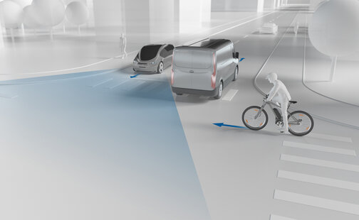 An animated image shows an intersection with two cars and a cyclist. Arrows indicate the direction each road user is traveling.