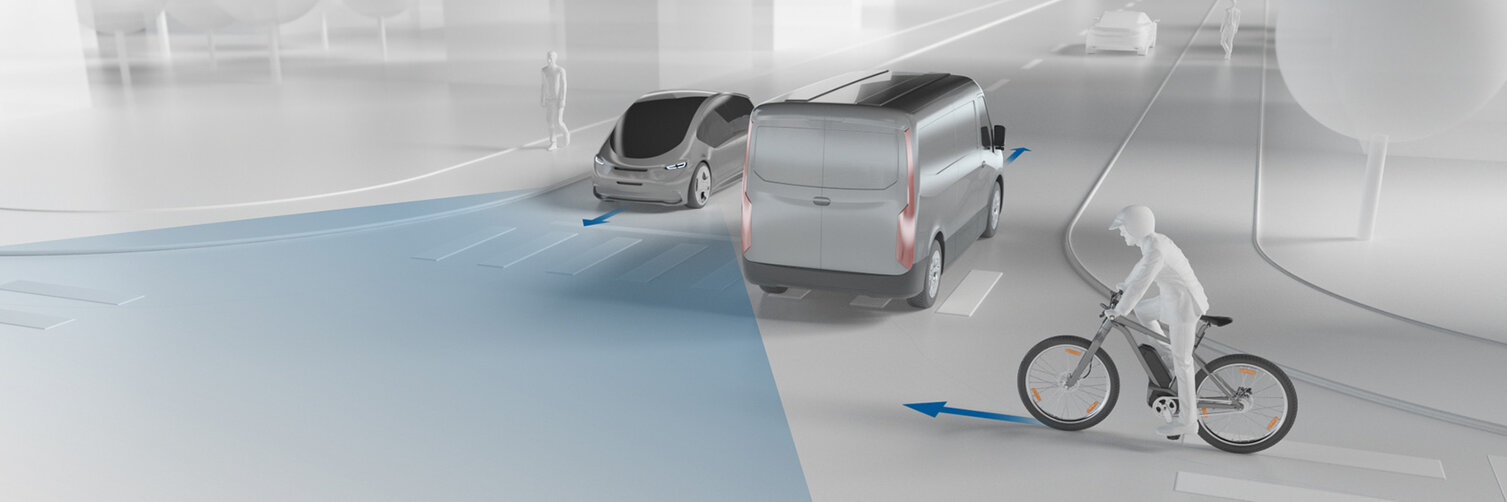 An animated image shows an intersection with two cars and a cyclist. Arrows indicate the direction each road user is traveling.