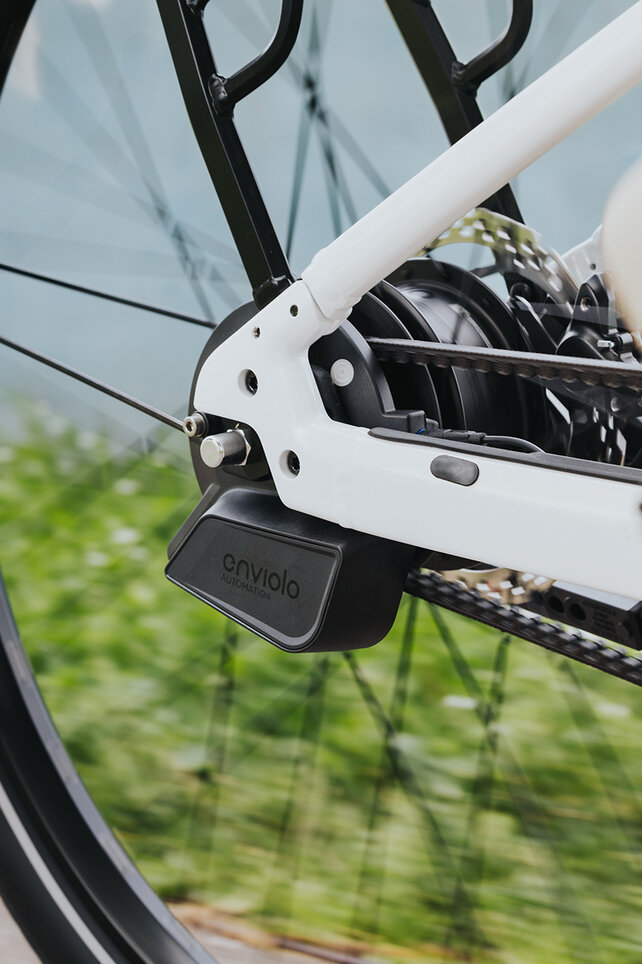 Close-up of a rear wheel focusing on the rear derailleur.
