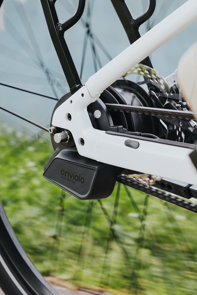 Close-up of a rear wheel focusing on the rear derailleur.
