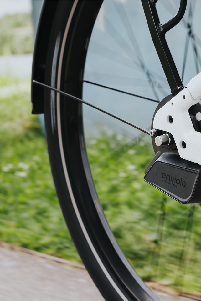 Close-up of a rear wheel focusing on the rear derailleur.