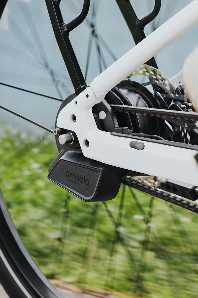 Close-up of a rear wheel focusing on the rear derailleur.