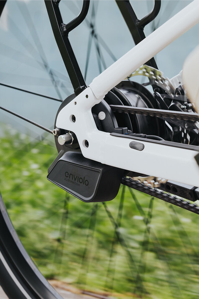 Close-up of a rear wheel focusing on the rear derailleur.