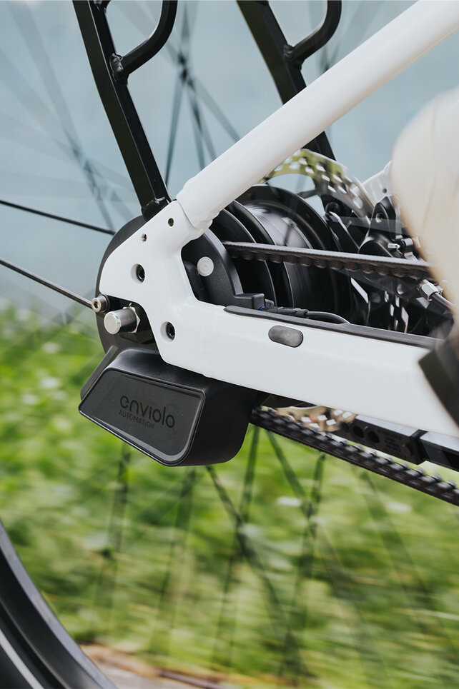 Close-up of a rear wheel focusing on the rear derailleur.