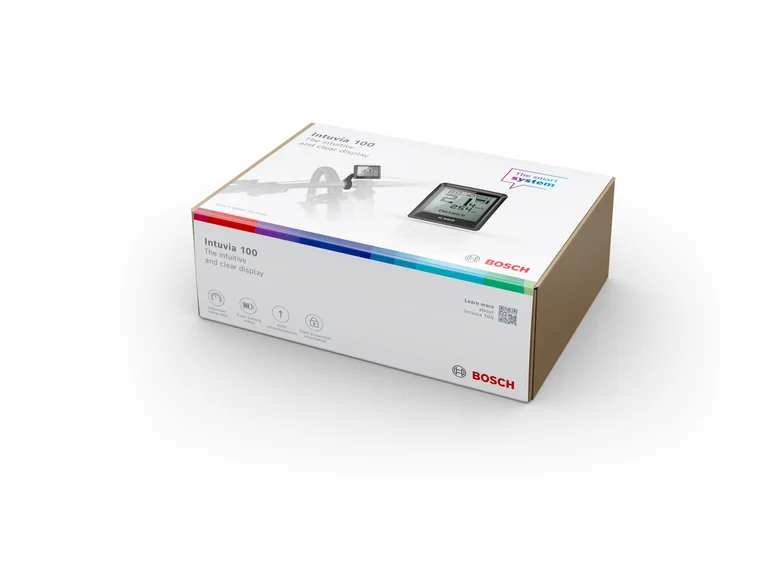 Eine Verpackung des Bosch Intuvia 100 Displays. Die Box zeigt das Produktbild und verschiedene Funktionen.