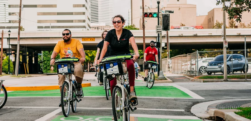 Houston eBike Rider Group rides eBikes in the city's bike lane.