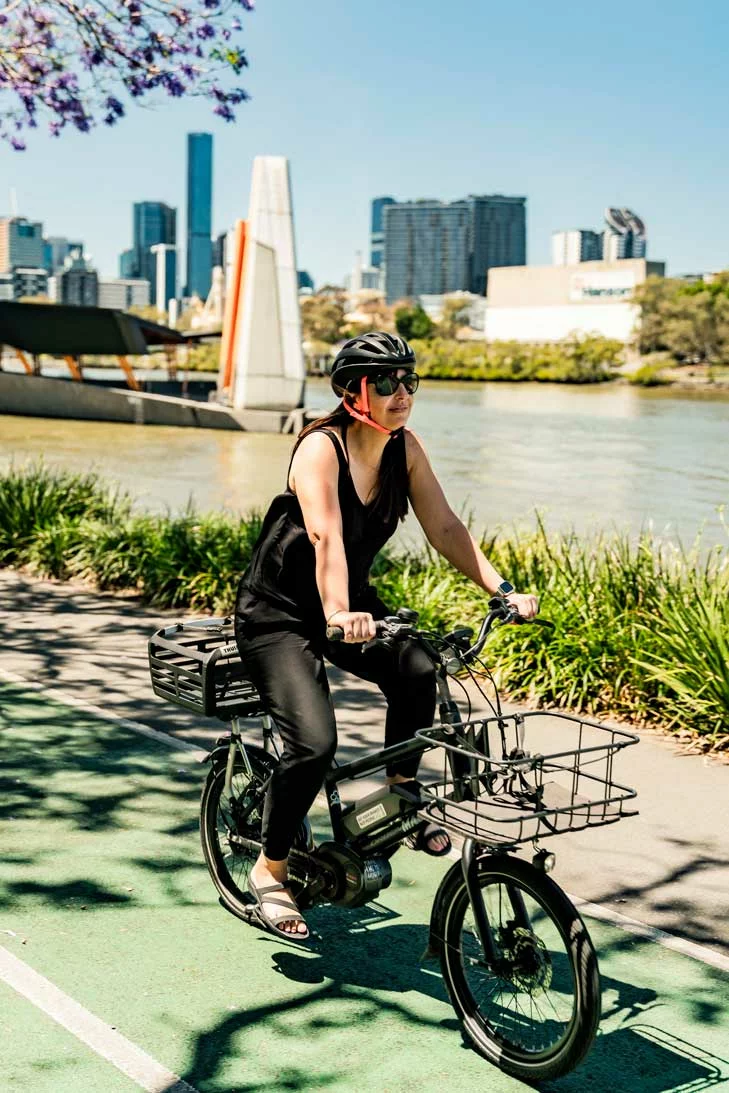 Fiona eBikes regularly along Brisbane River