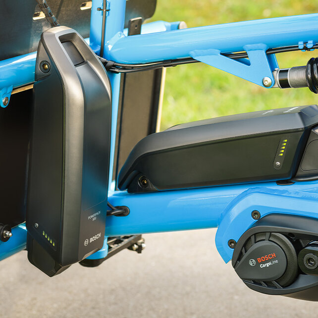 Close-up of the dual battery on a blue Cargo eBike.