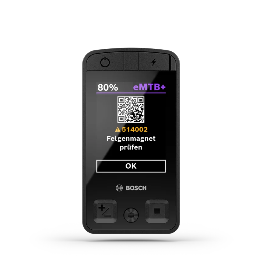 Screenshot eines eBike-Displays, das eine Fehlermeldung A514002 "Felgenmagnet prüfen" anzeigt, sowie einen QR-Code für weitere Informationen.