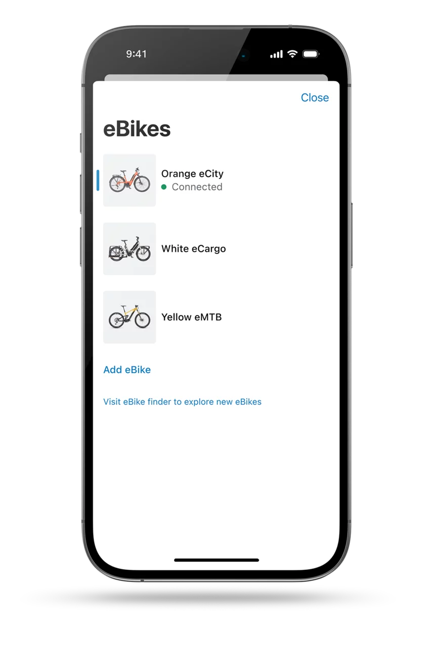 The eBike Flow app screen is displayed as a cropped model. The screen showcases the digital garage of the eBike Flow app, displaying three different eBike models.