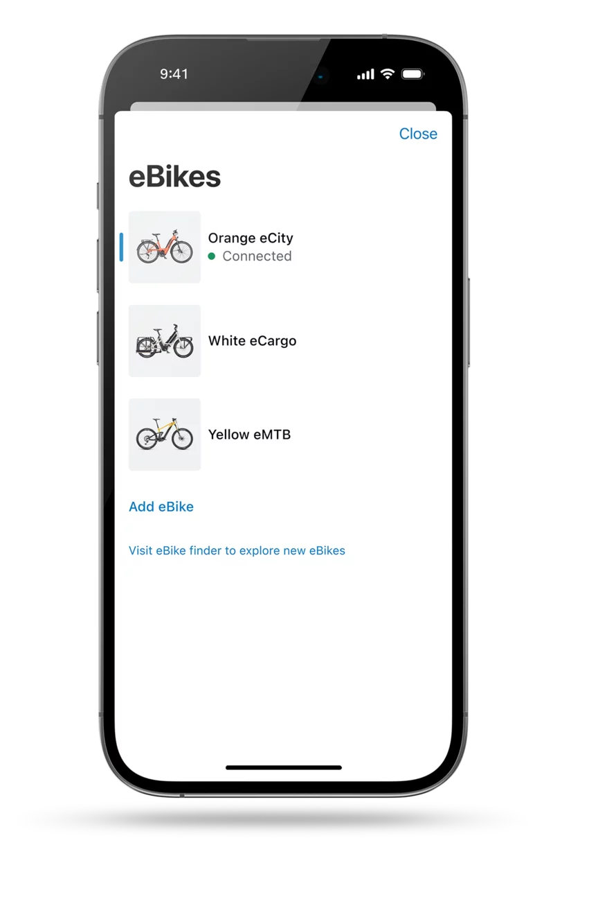 The eBike Flow app screen is displayed as a cropped model. The screen showcases the digital garage of the eBike Flow app, displaying three different eBike models.